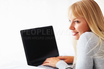 Buy stock photo Thinking, happy and woman with laptop for reading, relax and social media for networking in apartment. Female student, and gen z with technology, research and online app with idea for scholarship 