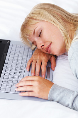 Buy stock photo Laptop, sleeping and woman on bed for relax with research for freelance creative career at apartment. Rest, technology and tired female copywriter with nap on computer working on project in bedroom.