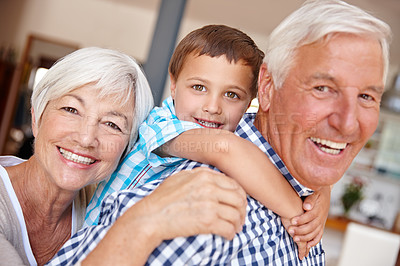 Buy stock photo Cropped shot of a young boy with his grandparents