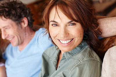 Buy stock photo Portrait of a mature woman sitting beside her husband