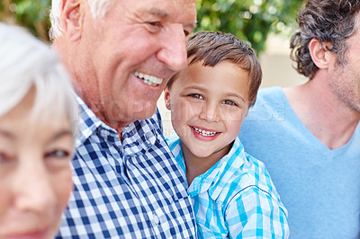 Buy stock photo Cropped shot of a young boy with his grandparents