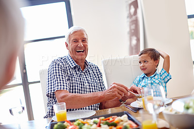 Buy stock photo Shot of a family enjoying a meal together