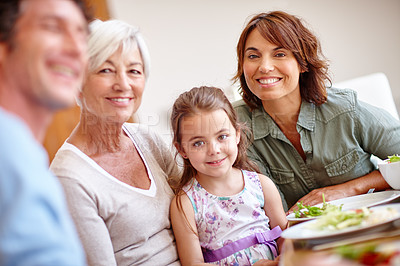 Buy stock photo Shot of a multi-generational family having a meal together