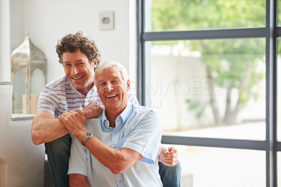 Buy stock photo Portrait of a man bonding with his father indoors