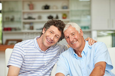 Buy stock photo Portrait of a man and his father sitting together at home