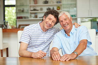 Buy stock photo Portrait of a man and his father sitting together at home
