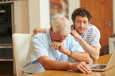 Buy stock photo Shot of a man consoling his senior father at home