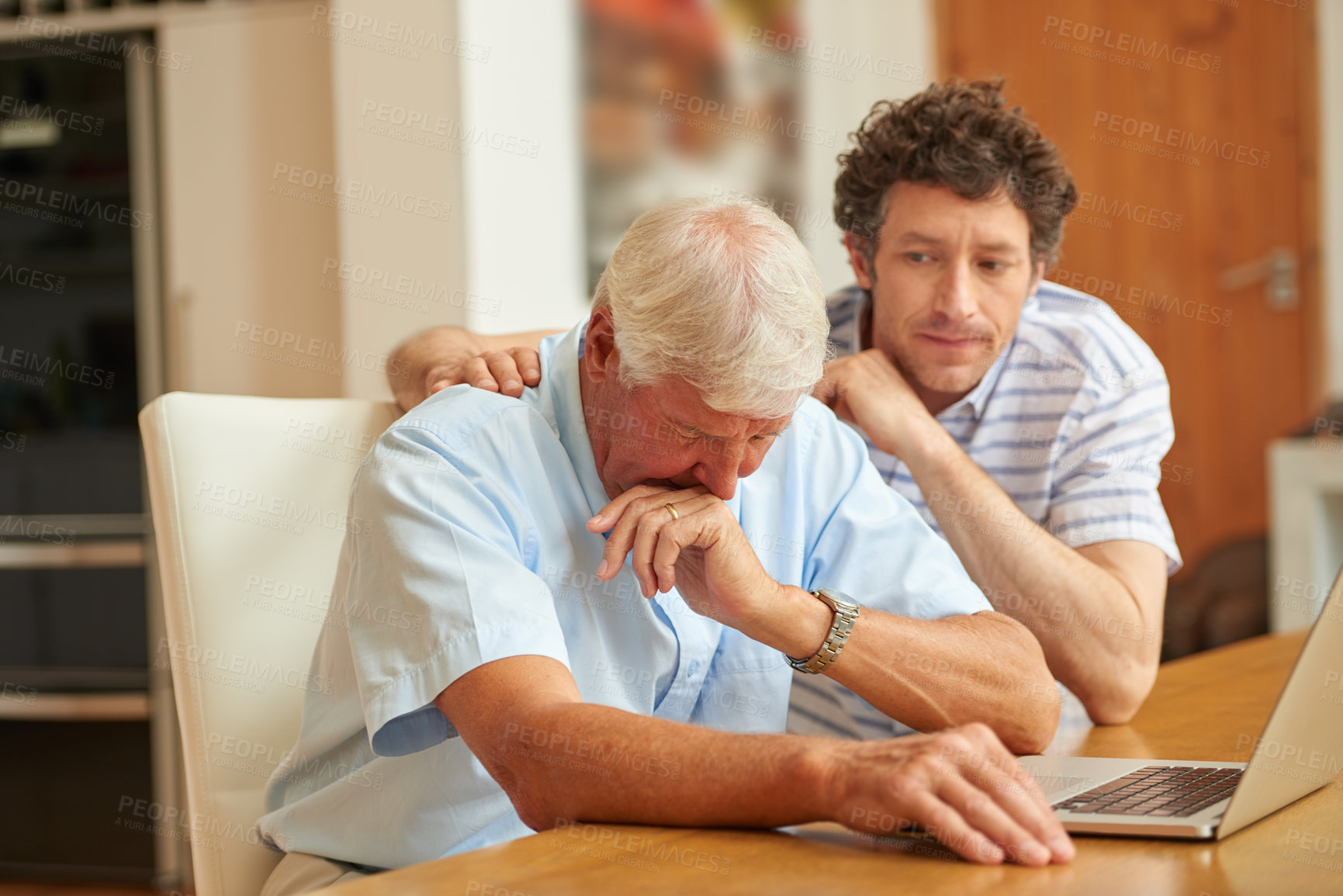 Buy stock photo Shot of a man consoling his senior father at home