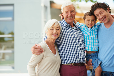 Buy stock photo Portrait of a little boy with his father and grandparents outside