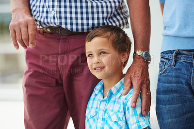Buy stock photo Cropped shot of a little boy standing outside with his family