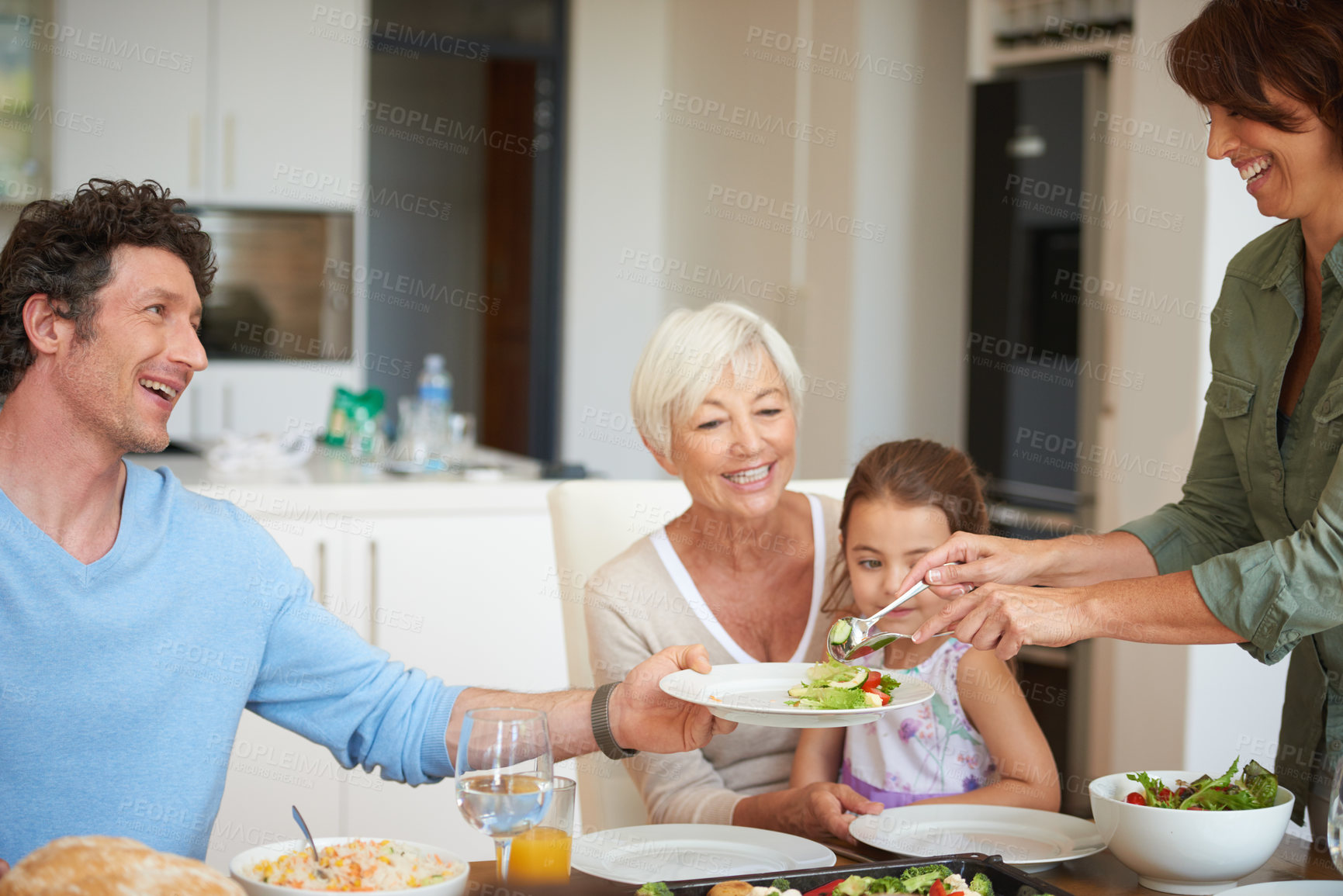 Buy stock photo Shot of a multi-generational family having lunch together