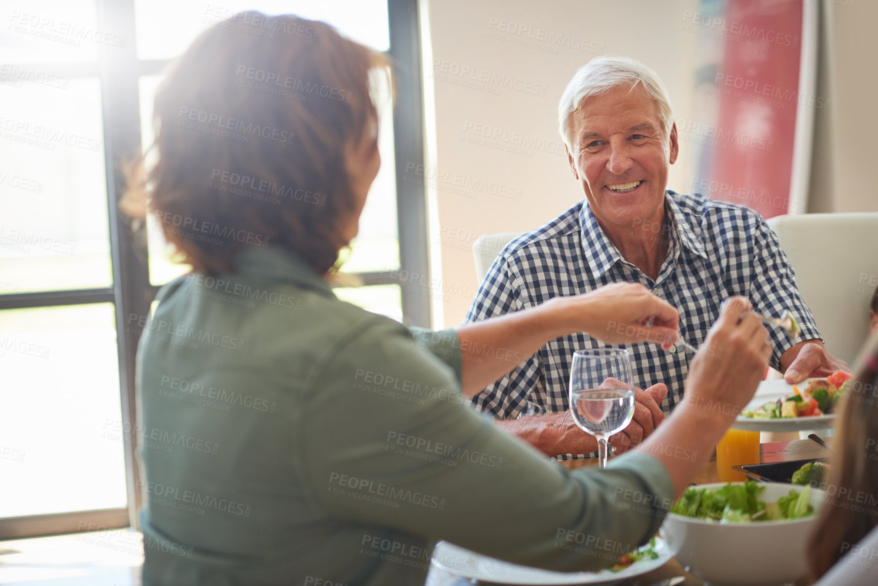 Buy stock photo Shot of a family having lunch together