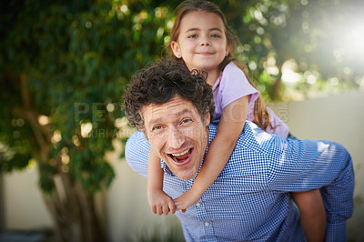 Buy stock photo Portrait of a father giving his daughter a piggyback ride outside