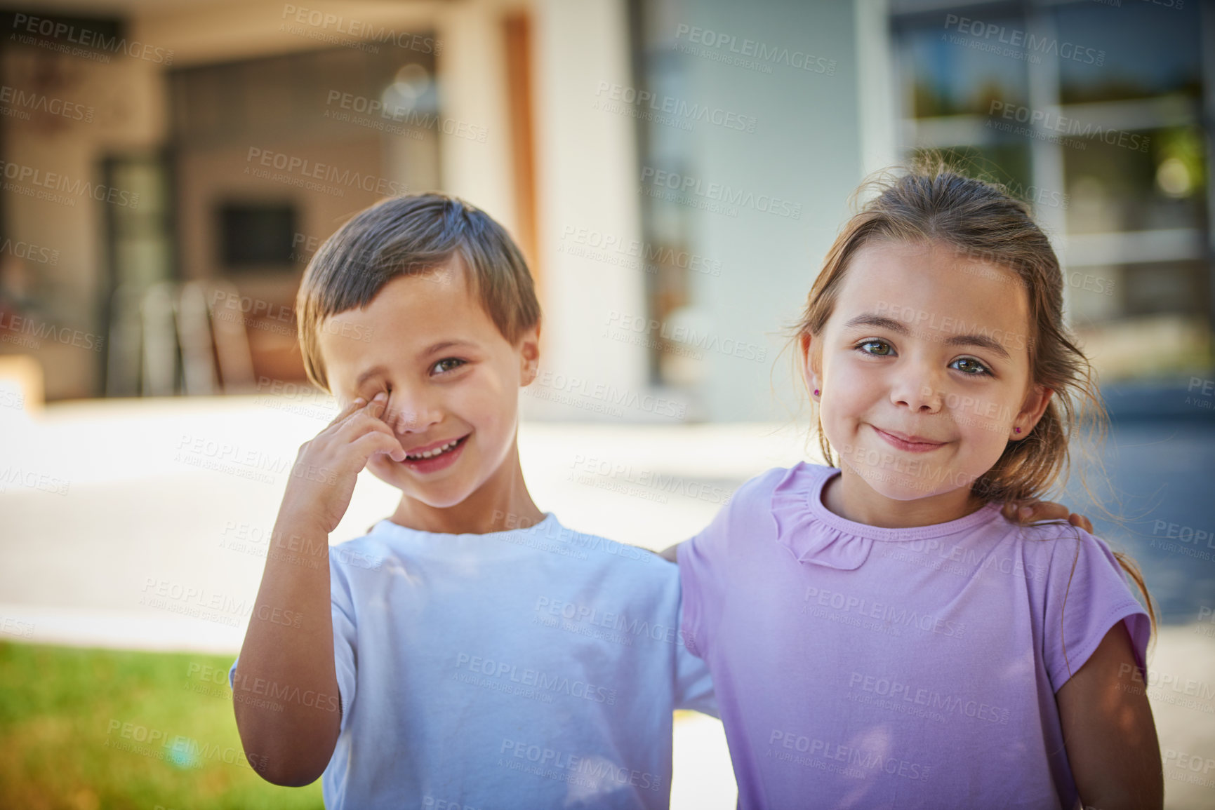 Buy stock photo Portrait of a young brother and sister standing together outside their house