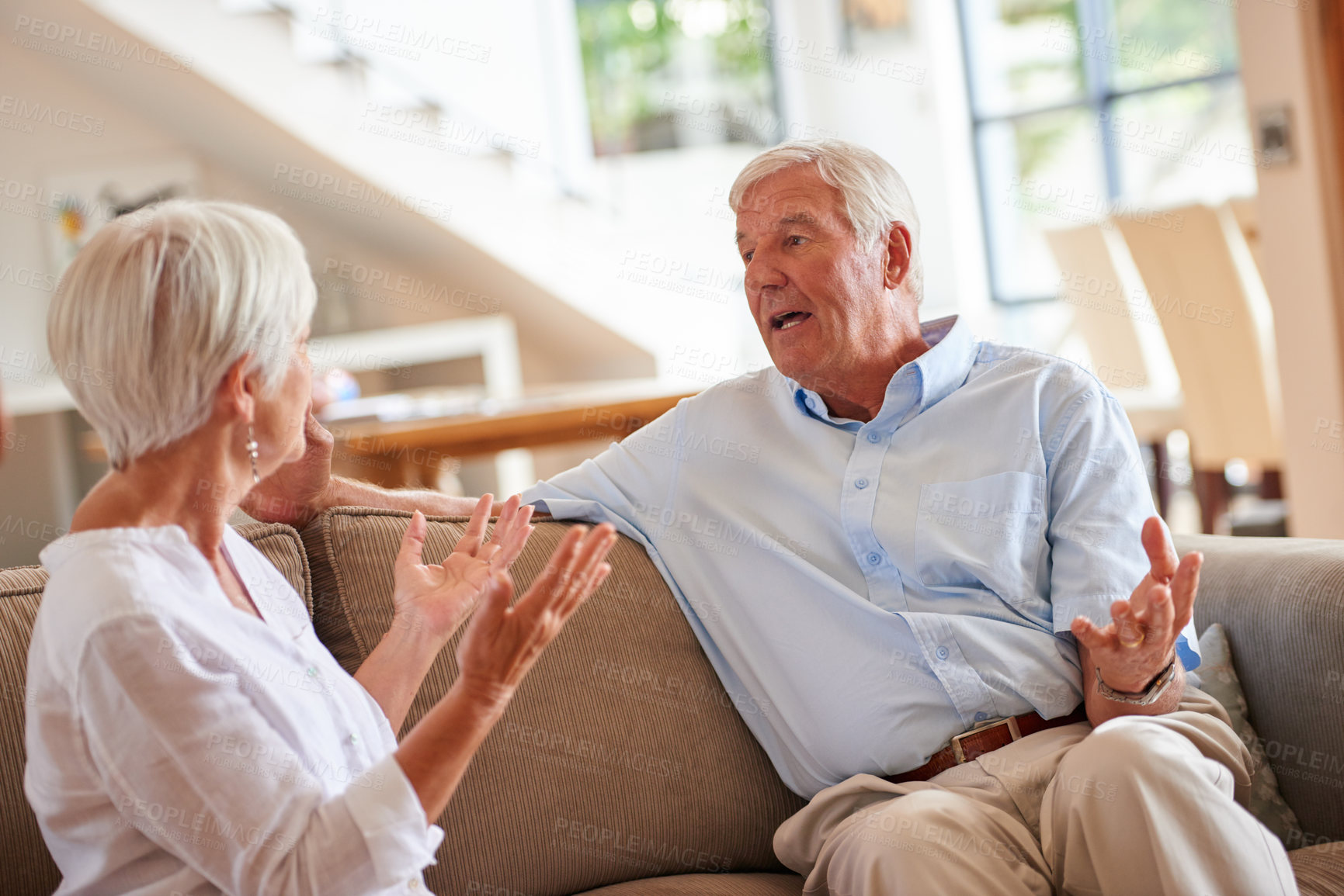 Buy stock photo Shot of a senior couple having an argument at home