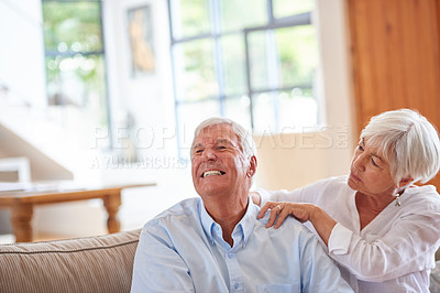 Buy stock photo Shot of a senior woman massaging her husband's shoulders
