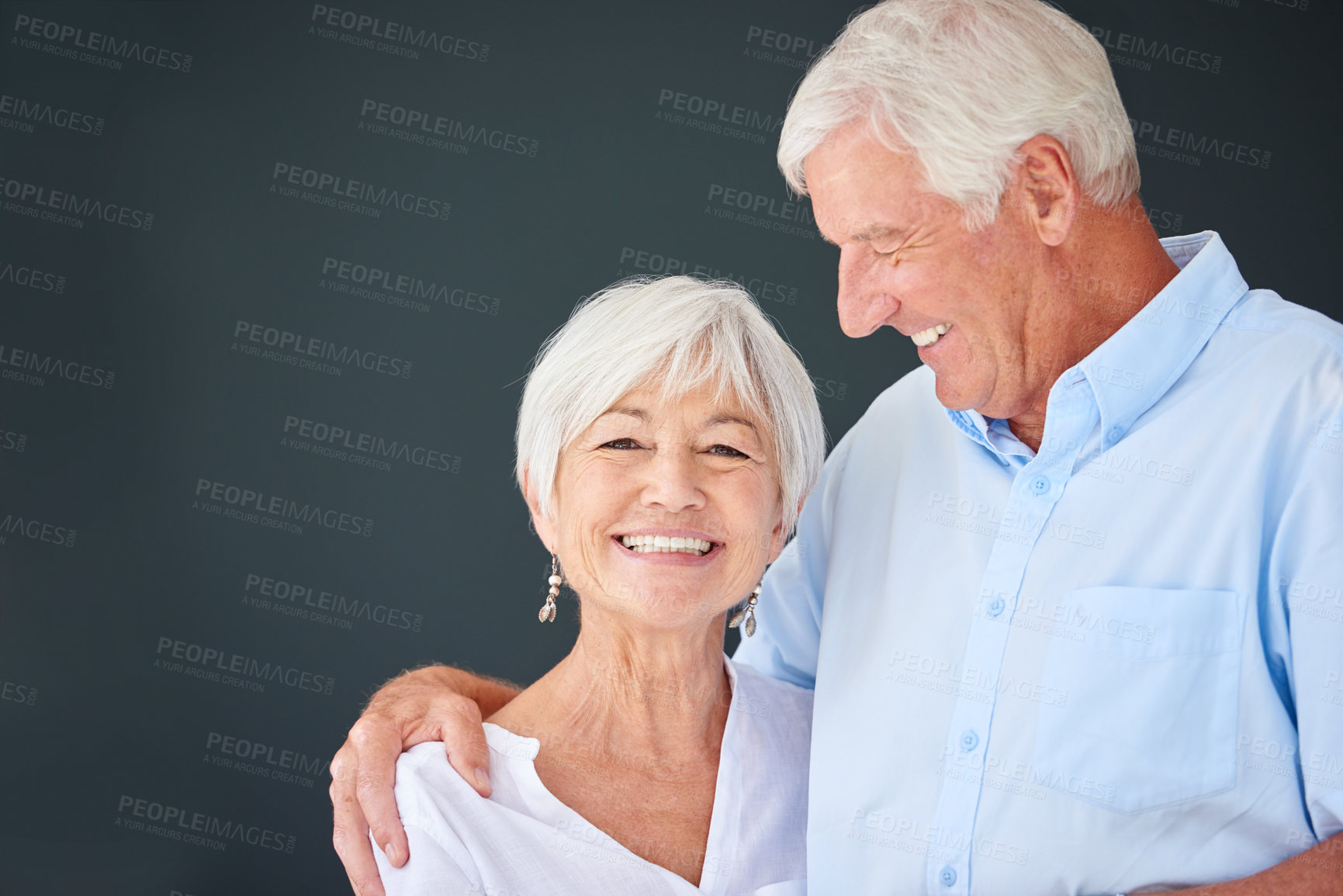 Buy stock photo Shot of a happy senior couple  against a gray background