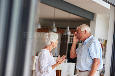 Buy stock photo Shot of a senior couple having an argument