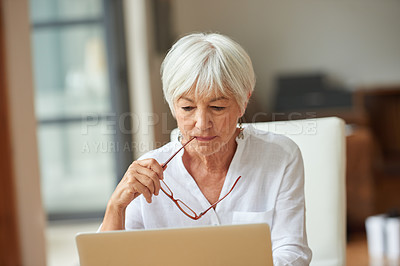 Buy stock photo Shot of a senior woman using a laptop