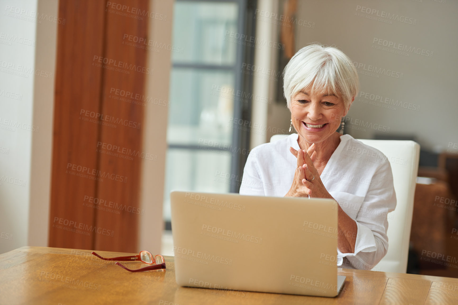 Buy stock photo Shot of a senior woman using a laptop