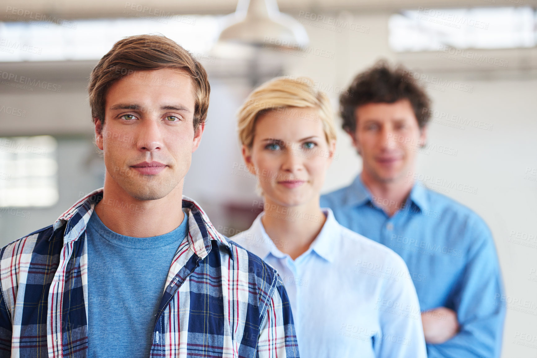 Buy stock photo Cropped portrait of three businesspeople standing in the office