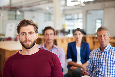 Buy stock photo A group of colleagues listening to a presentation