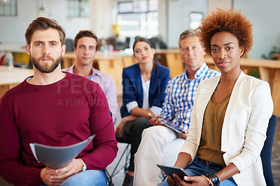 Buy stock photo A group of colleagues listening to a presentation