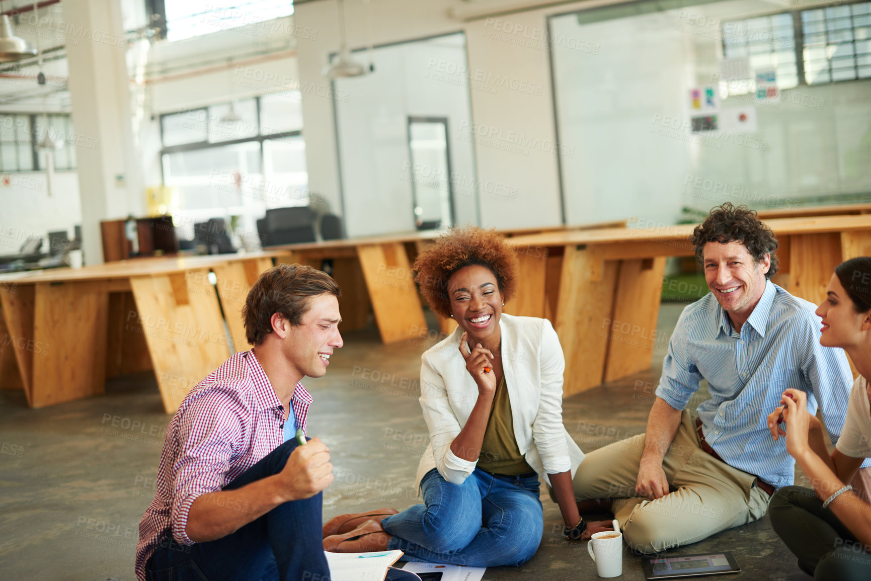 Buy stock photo Shot of a group of designers working together on a office floor