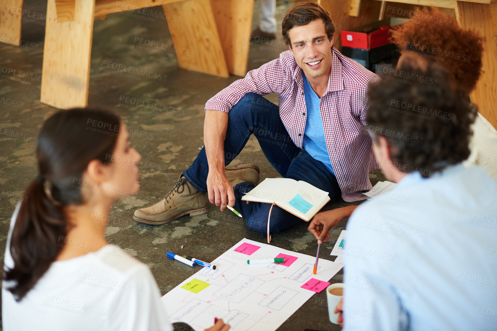 Buy stock photo Shot of a group of designers working together on a office floor