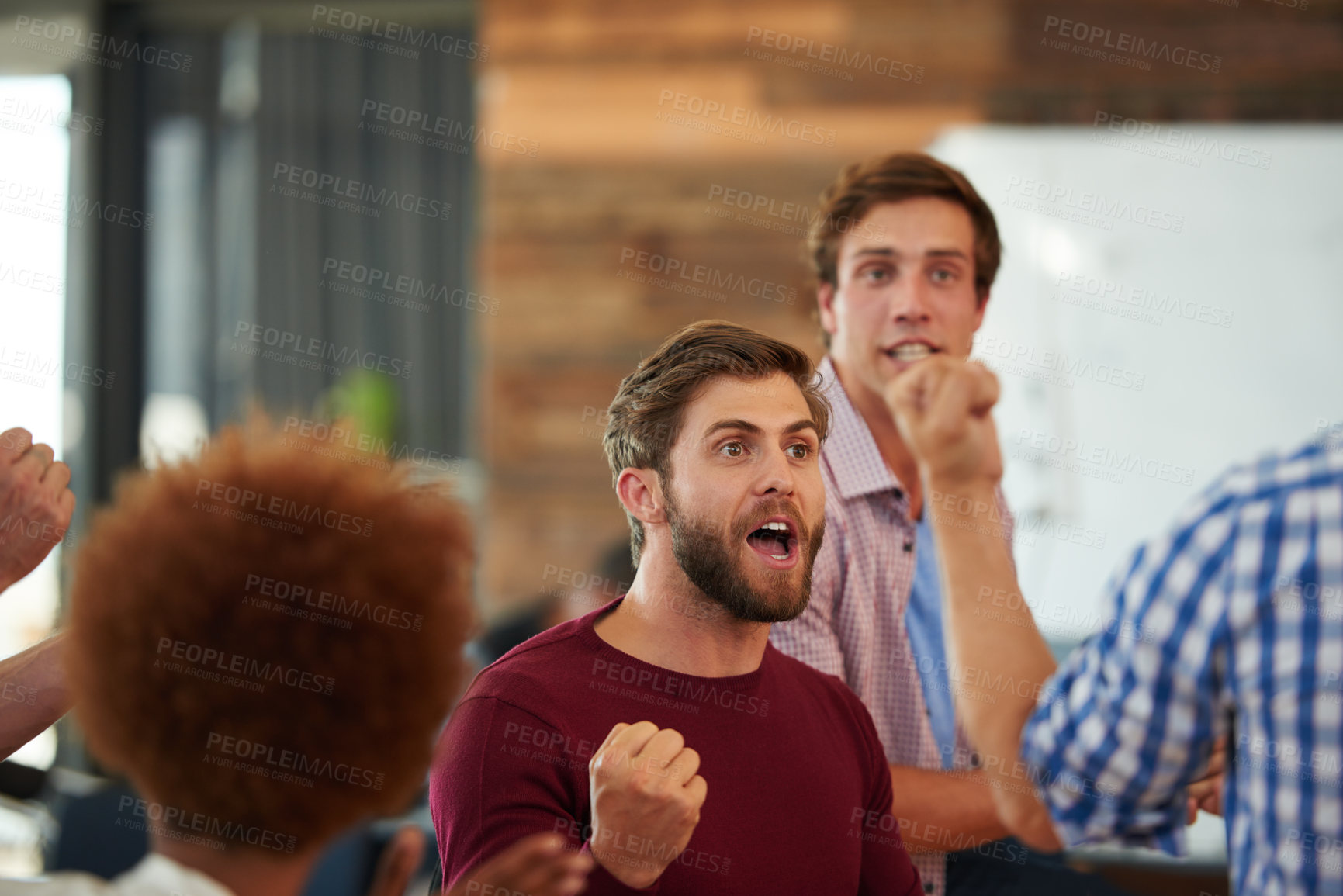 Buy stock photo Shot of a group of designers looking excited during an informal meeting