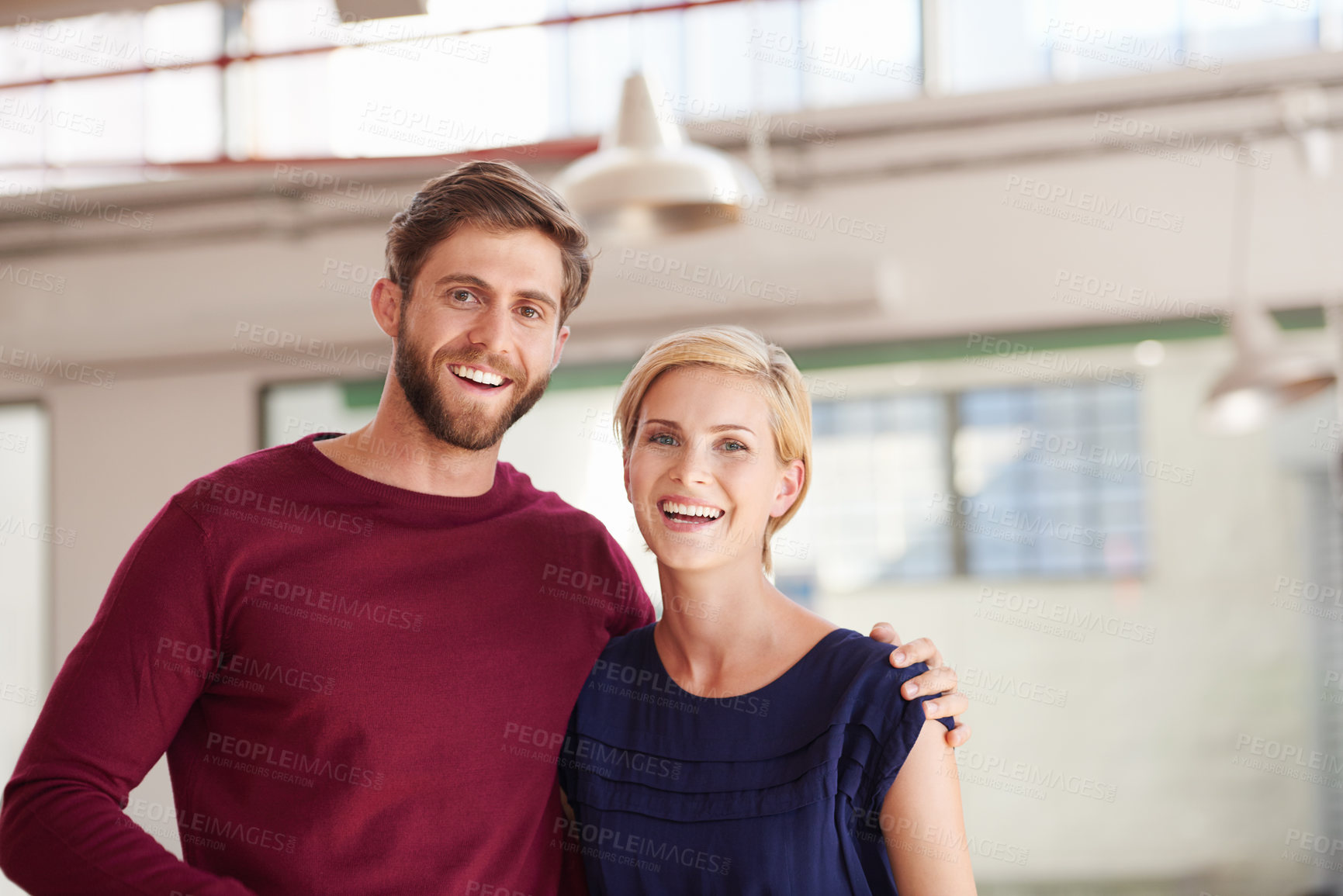 Buy stock photo Shot of a couple working together in an open office