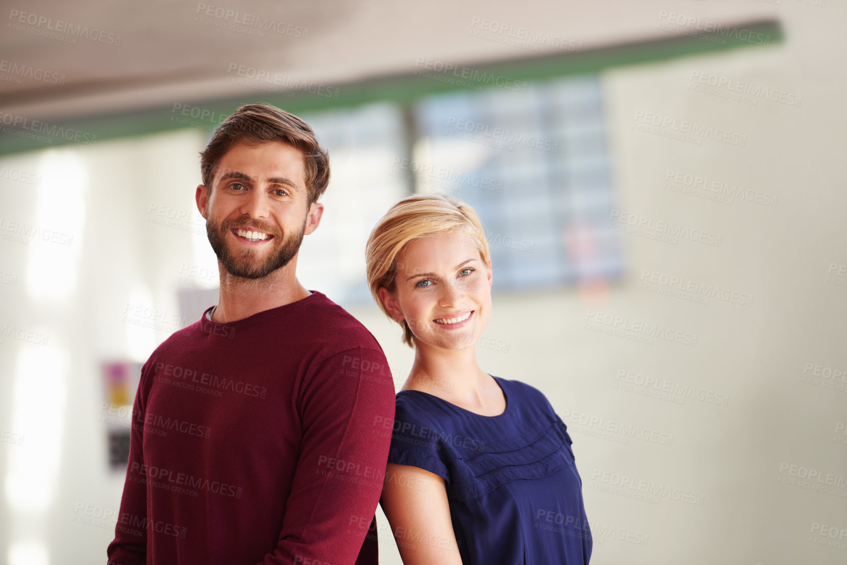 Buy stock photo Shot of a couple working together in an open office