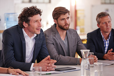Buy stock photo Cropped shot of businesspeople in a meeting