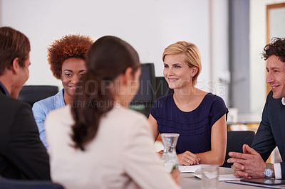 Buy stock photo Cropped shot of businesspeople in a meeting
