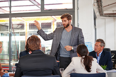 Buy stock photo Cropped shot of a businessman addressing his colleagues during a meeting