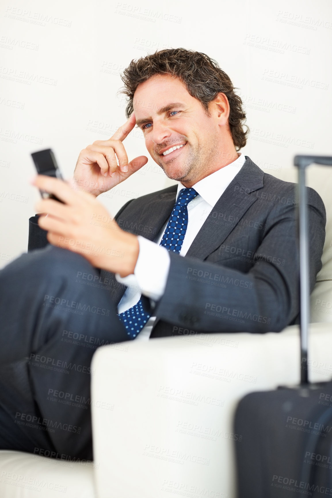 Buy stock photo Smile, phone or businessman in airport lounge for travel, vacation or salesman booking hotel. Mobile, luggage or professional in lobby for journey, immigration or reading flight schedule on cellphone