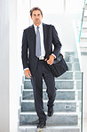 Smart executive carrying an office bag