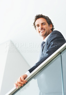 Buy stock photo Businessman, smile and portrait with staircase in office for finance career, trader with cryptocurrency. Male investor, workplace or happiness in low angle view for blockchain, investment and finance