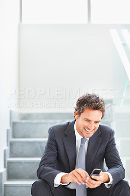 Buy stock photo Office, smile and businessman with phone on stairs for communication, planning or reading business news. Happy, financial advisor and thinking with tech for research, digital consulting or networking