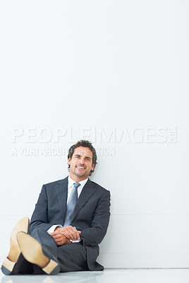 Buy stock photo Portrait, businessman and on floor with smile for relax, pride and isolated by white background for mockup. Professional, male lawyer and happy in studio for job, career and attorney in workplace