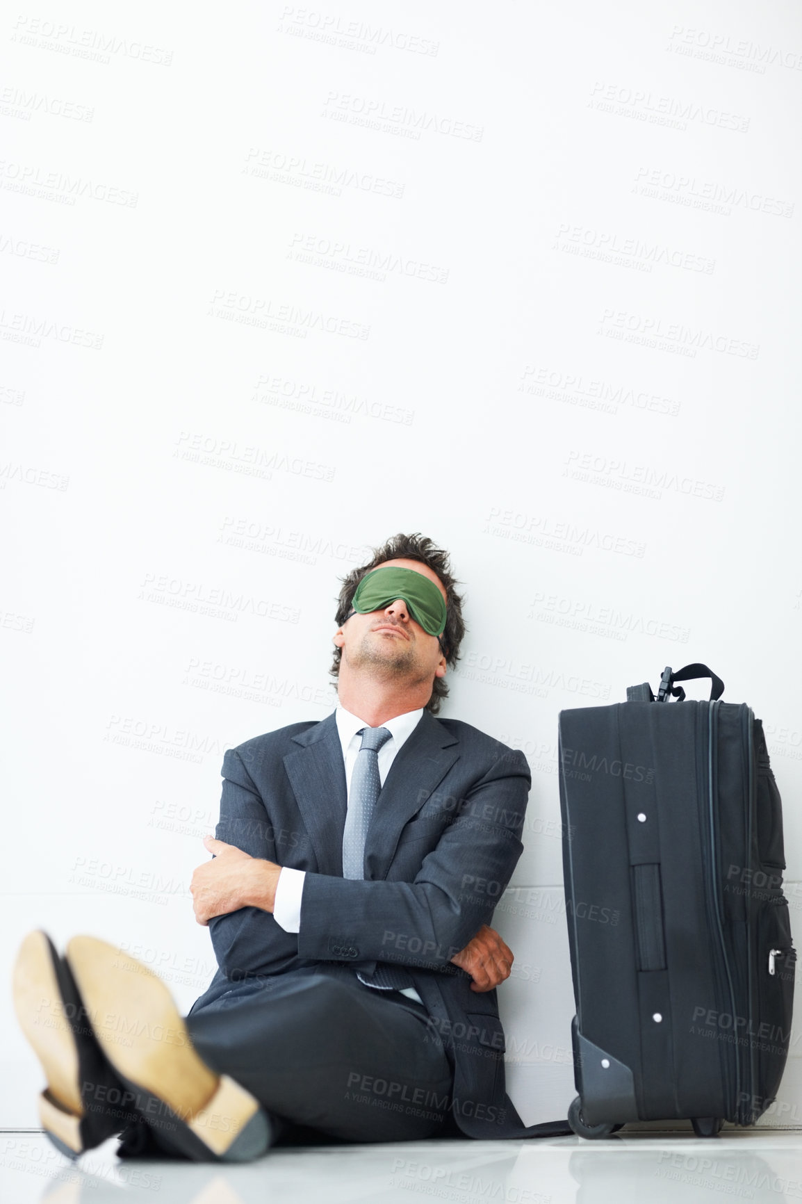 Buy stock photo Sleeping, luggage and man with mask in airport for business trip, international flight or departure. Lobby, delay and professional male person on floor for check in problem, travel or journey