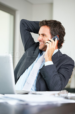 Buy stock photo Relaxed business man having a friendly conversation on mobile phone