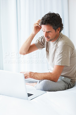 Buy stock photo Thinking, man in bedroom and laptop for work from home, confused and doubt in bed for freelance job. Technology, entrepreneur person and remote worker for online, company and marketing projects