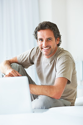 Buy stock photo Portrait, happy man in bedroom and laptop to work from home, smiling and sitting in bed for freelance job. Technology, Entrepreneur and remote worker for online job, company and marketing projects
