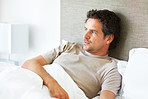 Man relaxing in bed