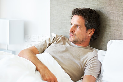 Buy stock photo Thinking, depression and man in bed with mental health crisis, disaster or broken heart in his home. Overthinking, face and person in a bedroom with anxiety, stress or frustrated by insomnia fatigue