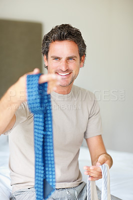 Buy stock photo Businessman, bedroom and choice for tie and fashion to wear at work in morning and smiling for style. Getting ready, shirt and deciding on outfit for business meeting, proud and confident with face