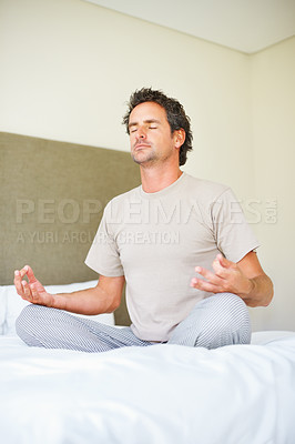 Buy stock photo Lotus hands, yoga pose and man on bed with meditation, peace and mental health wellness in his home. Breathing, balance and male person relax in bedroom with spiritual, healing or holistic self care