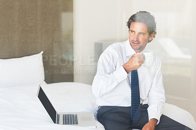 Buy stock photo Businessman, thinking or coffee and laptop in bedroom for morning routine, idea or networking and smile. Entrepreneur, person and face or happy with espresso, cappuccino or hot chocolate and internet