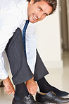 Smiling business man wearing shoes